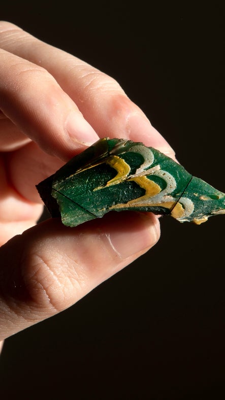 A fragment from a Roman glass fish found on an archaeological dig at Chedworth, Gloucester